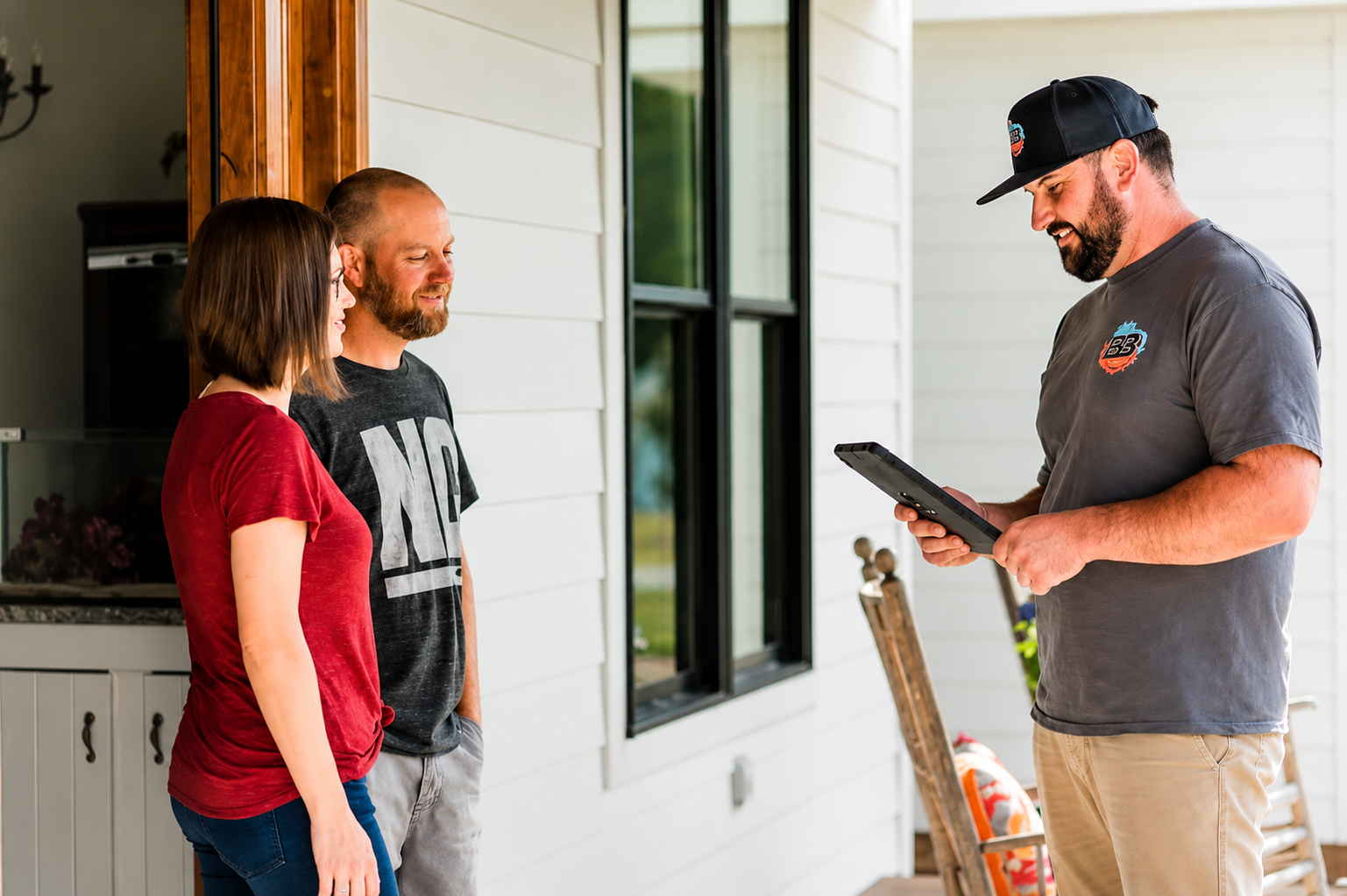 Technician consulting with homeowners